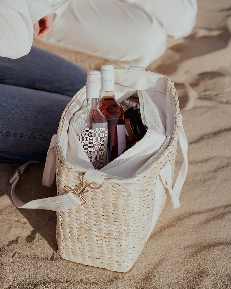 Two wine bottles standing upright inside the open tote